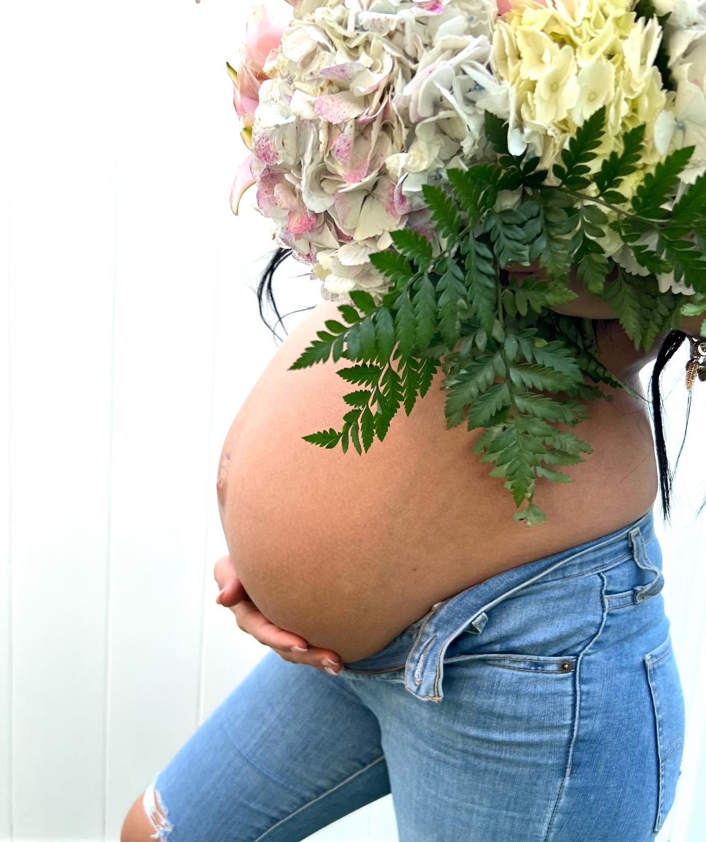 Pregnant woman holding her belly, pregnancy guides preview